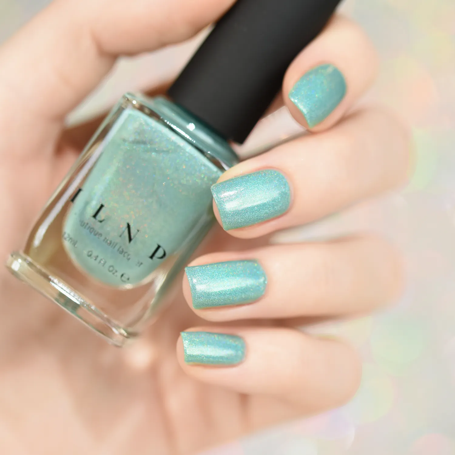 ILNP Music Box nagellack mjuk teal holo