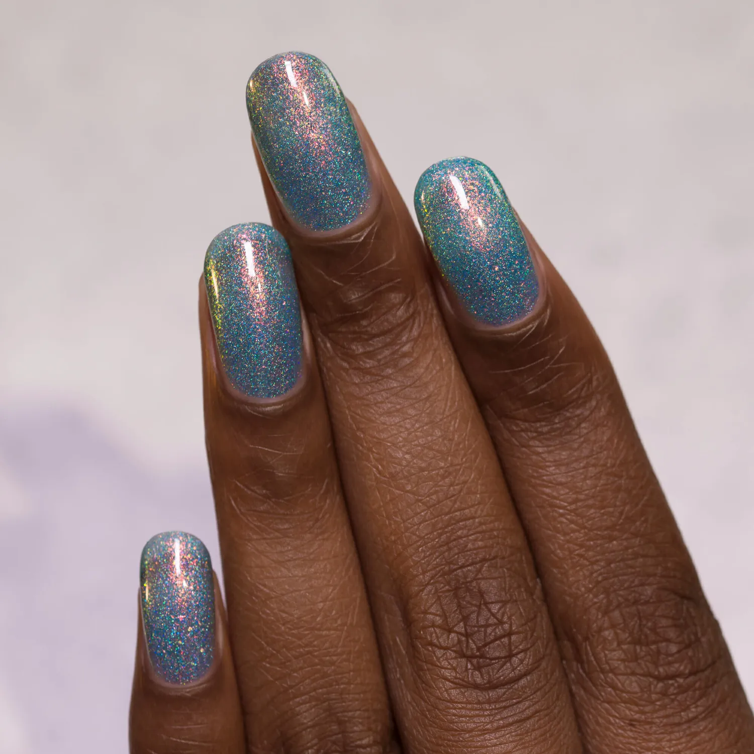 ILNP Skate Date nagellack teal jelly med orange-grönt skimmer