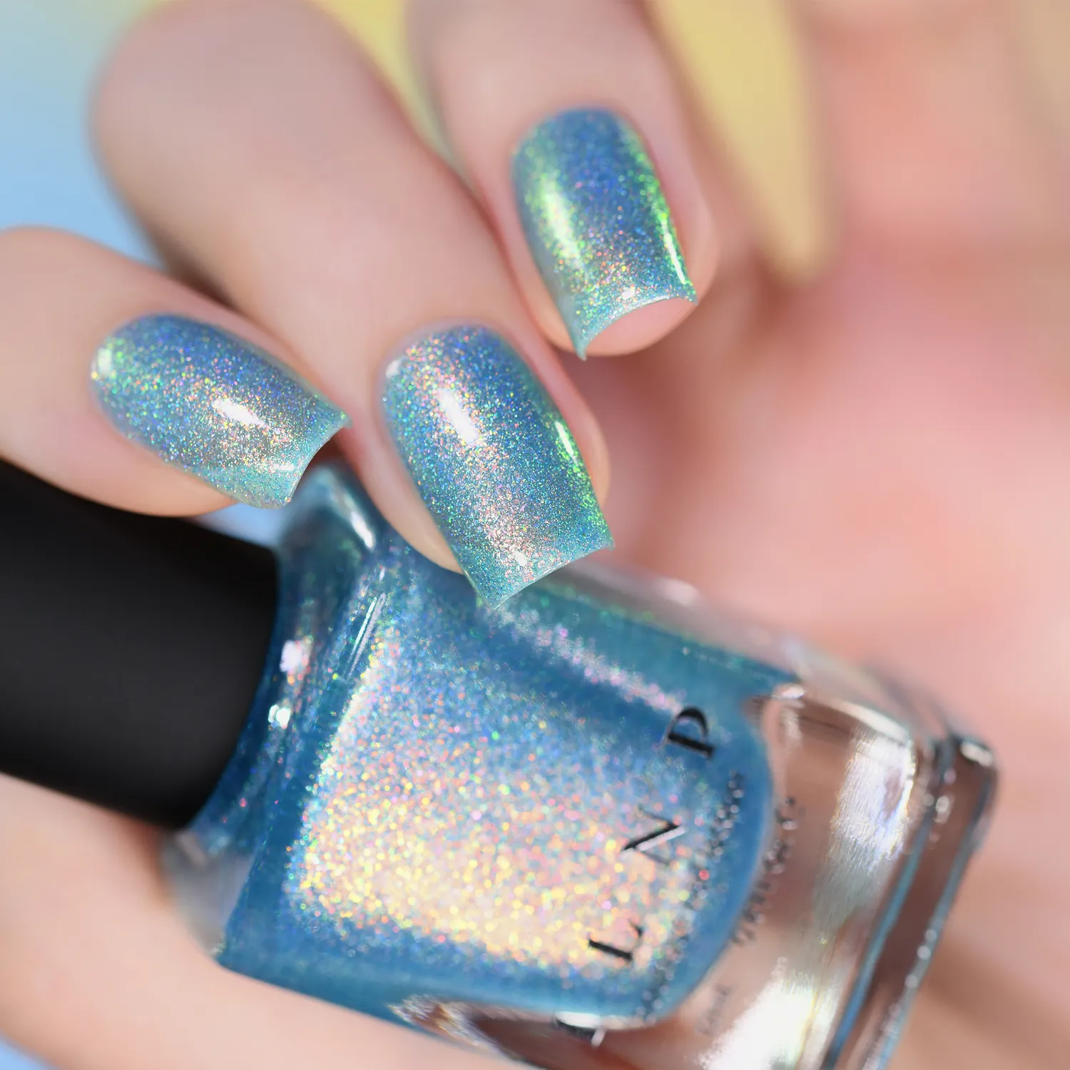 ILNP Skate Date nagellack teal jelly med orange-grönt skimmer